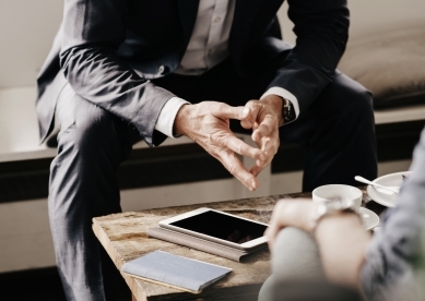 Close Up of Advisor and Client Hands Hands 